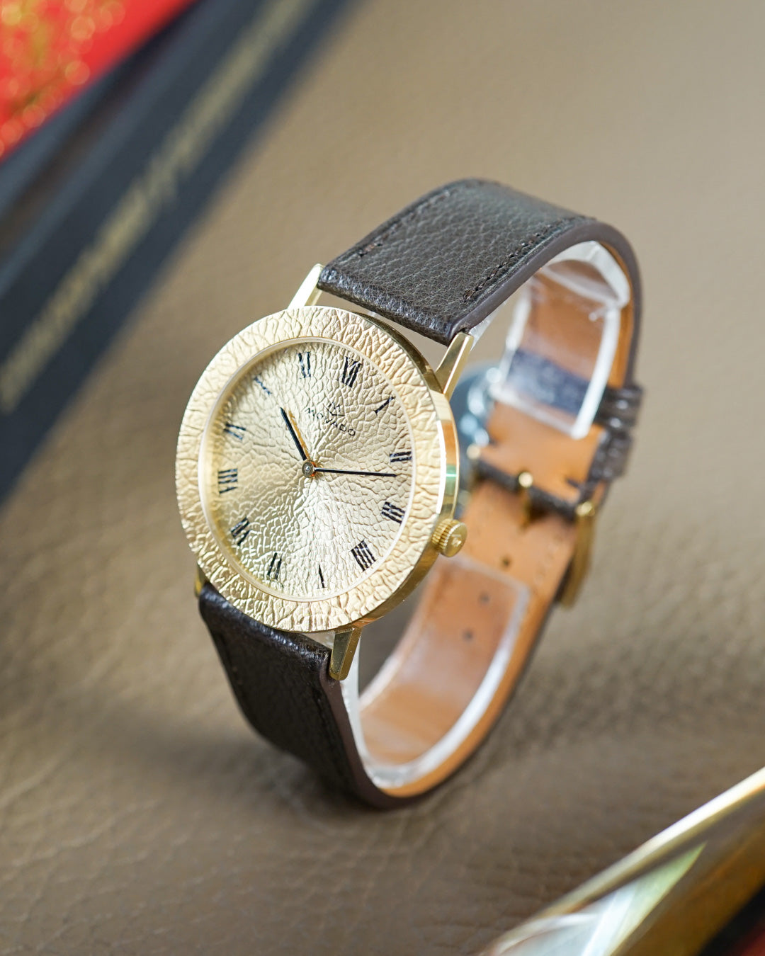 Movado "Gold Nugget" — hammered gold dial and bezel, 36mm, mint condition