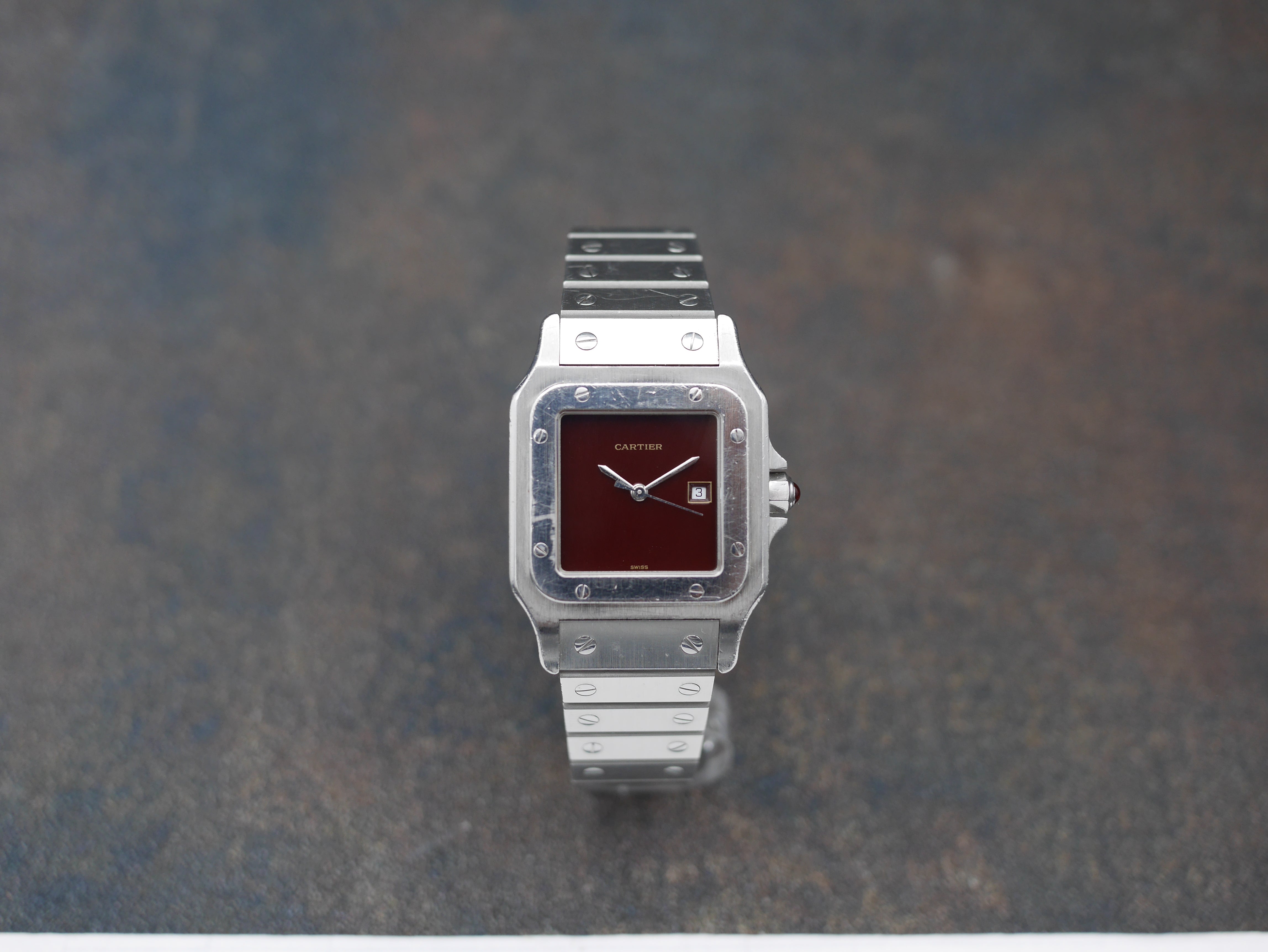 1980s Cartier Santos Stainless steel and its rare "bordeaux" dial and saphyr