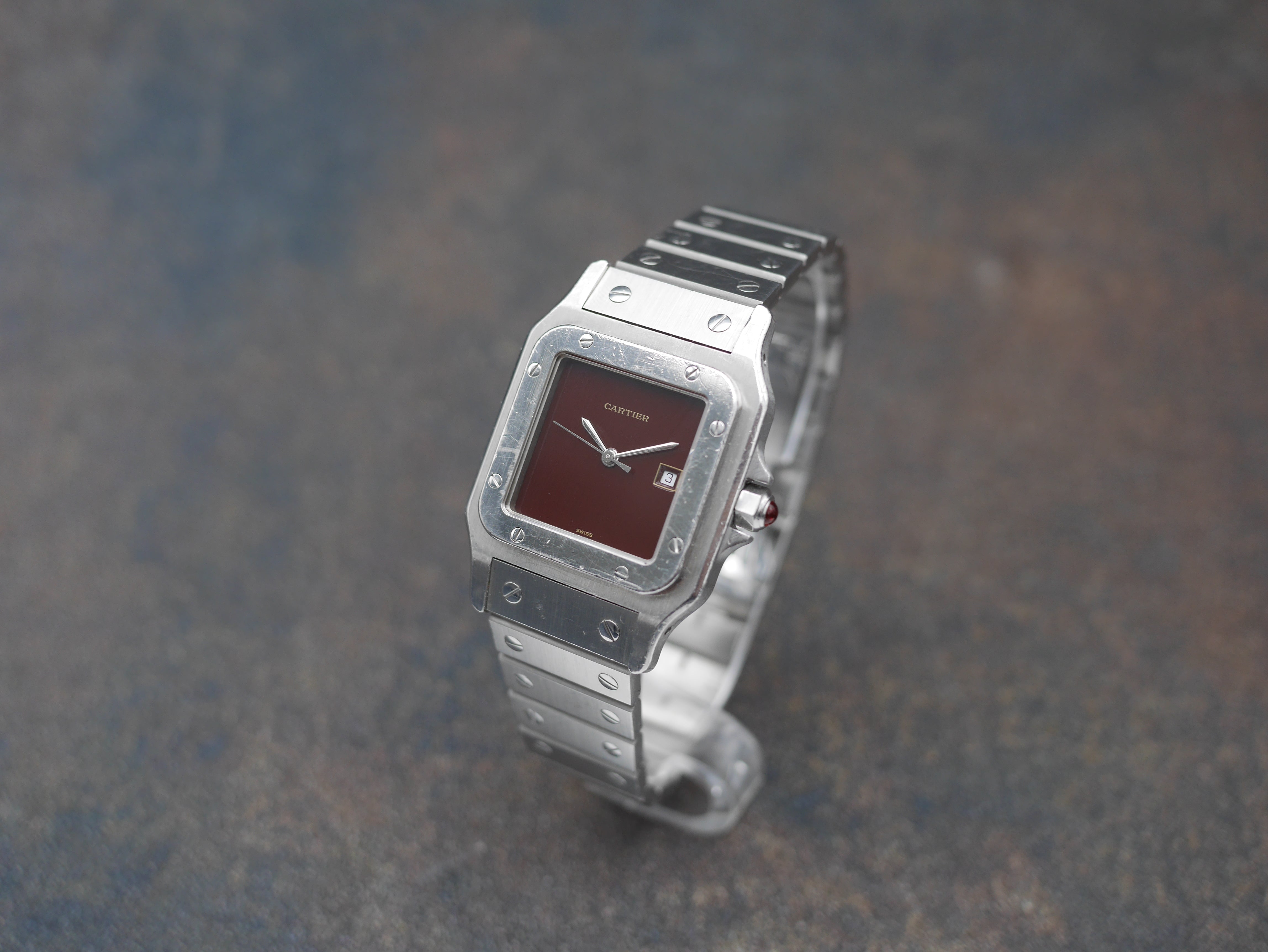 1980s Cartier Santos Stainless steel and its rare "bordeaux" dial and saphyr