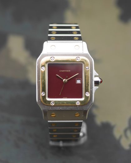 1980s Cartier Santos yellow gold & steel and its rare “bordeaux” dial and saphyr