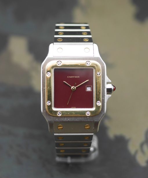 1980s Cartier Santos yellow gold & steel and its rare “bordeaux” dial and saphyr